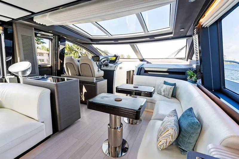 Yesenia Yacht Photos Pics Luxurious interior of 2024 Azimut S8 yacht with modern seating and panoramic windows.