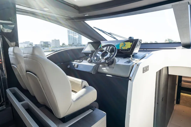 Yesenia Yacht Photos Pics 2024 Azimut S8 yacht cockpit with modern navigation system and luxurious seating.