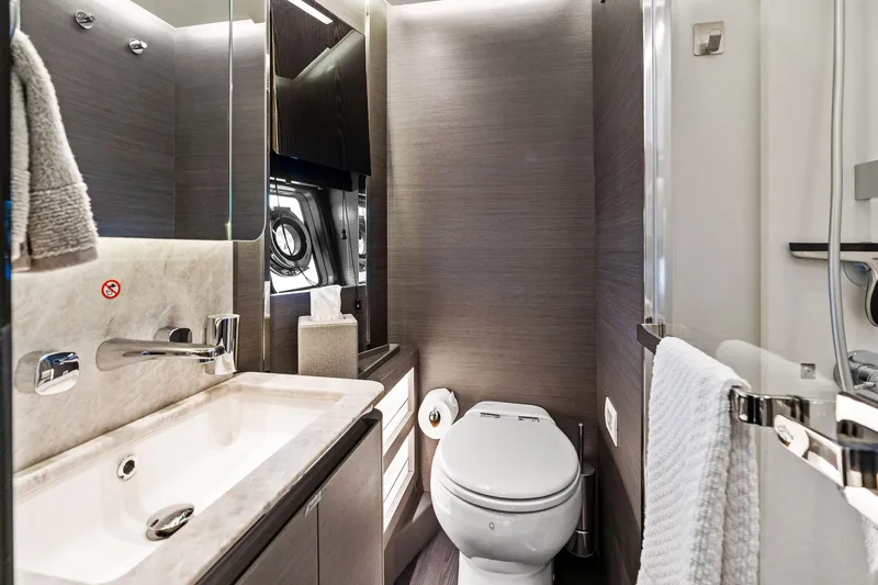 Yesenia Yacht Photos Pics Luxurious bathroom in 2024 Azimut S8 yacht, featuring modern fixtures and elegant design.