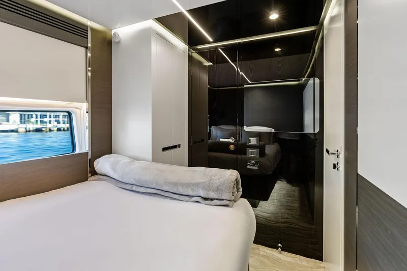 Yesenia Yacht Photos Pics Luxurious bedroom interior of 2024 Azimut S8 yacht with modern design and waterfront view.