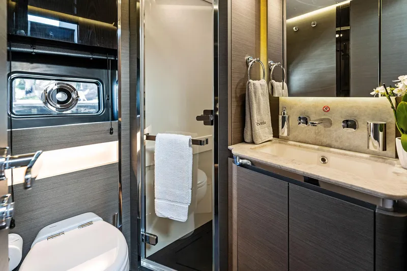 Yesenia Yacht Photos Pics Luxurious bathroom interior of 2024 Azimut S8 yacht, featuring modern fixtures and elegant design.