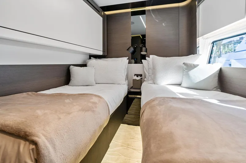 Yesenia Yacht Photos Pics Luxurious twin cabin in 2024 Azimut S8 yacht, featuring modern design and cozy bedding.