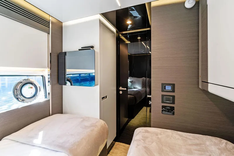 Yesenia Yacht Photos Pics Luxurious 2024 Azimut S8 yacht interior with twin beds and modern design.