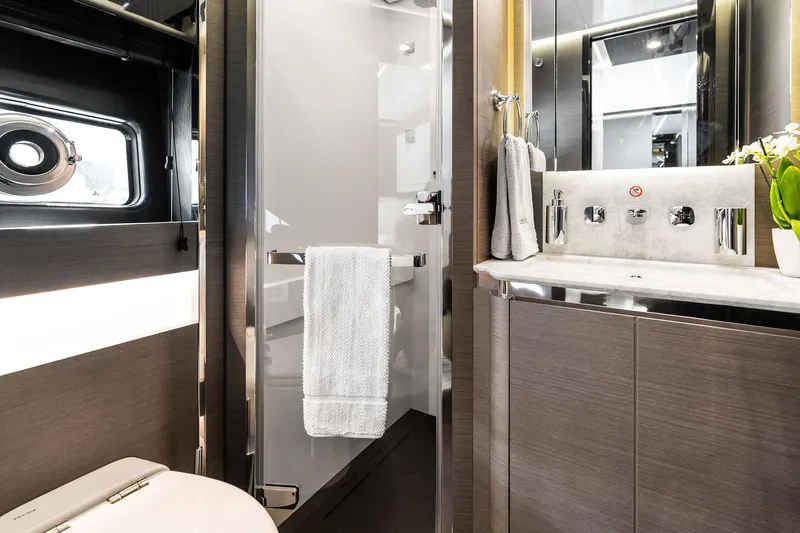 Yesenia Yacht Photos Pics Luxurious bathroom interior of 2024 Azimut S8 yacht with modern fixtures and elegant design.