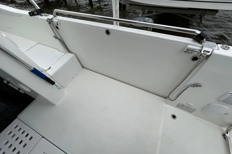  Yacht Photos Pics 2024 Beneteau Antares 11 boat deck with safety rail and clean white finish.