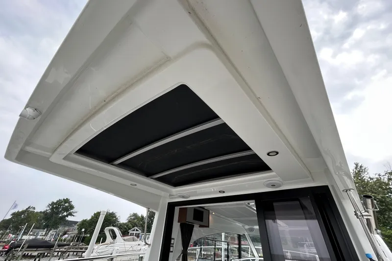  Yacht Photos Pics 2024 Beneteau Antares 11 boat roof with sleek design and integrated lighting.