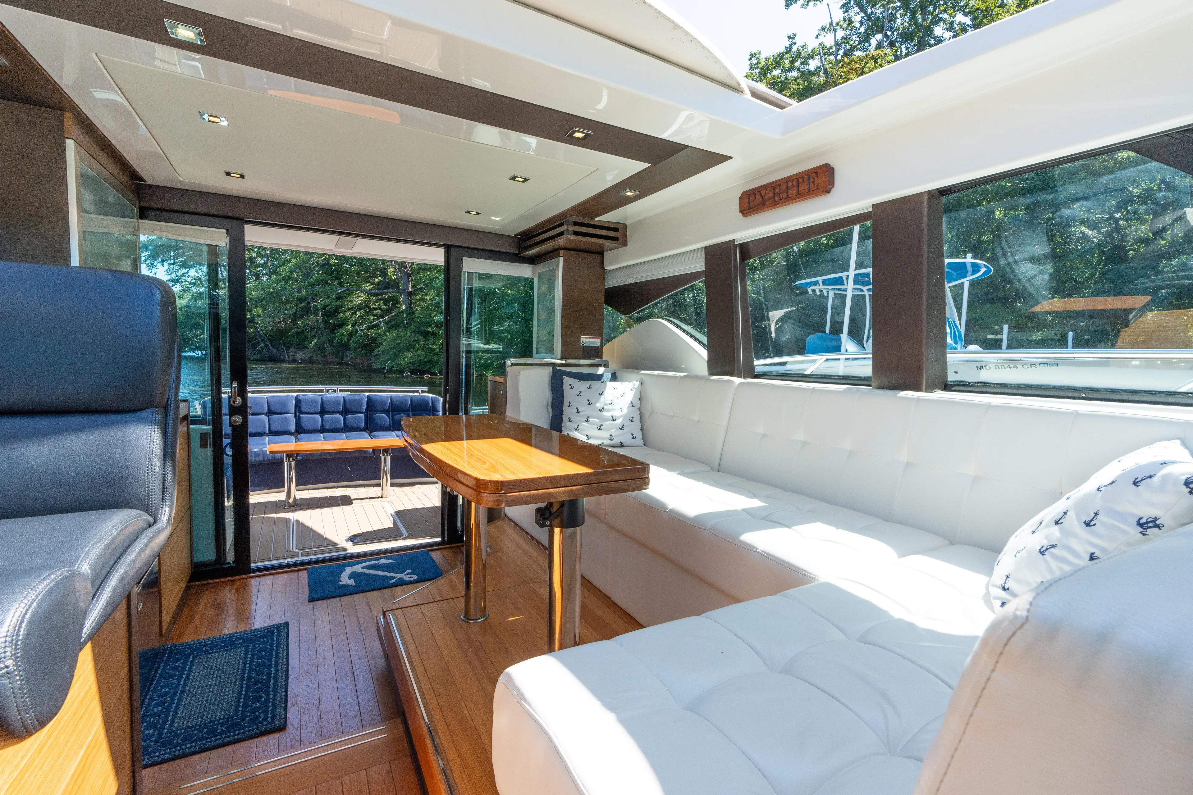 Pyrite Yacht Photos Pics Luxurious interior of 2015 Tiara Yachts C44 Coupe with plush seating and elegant design.