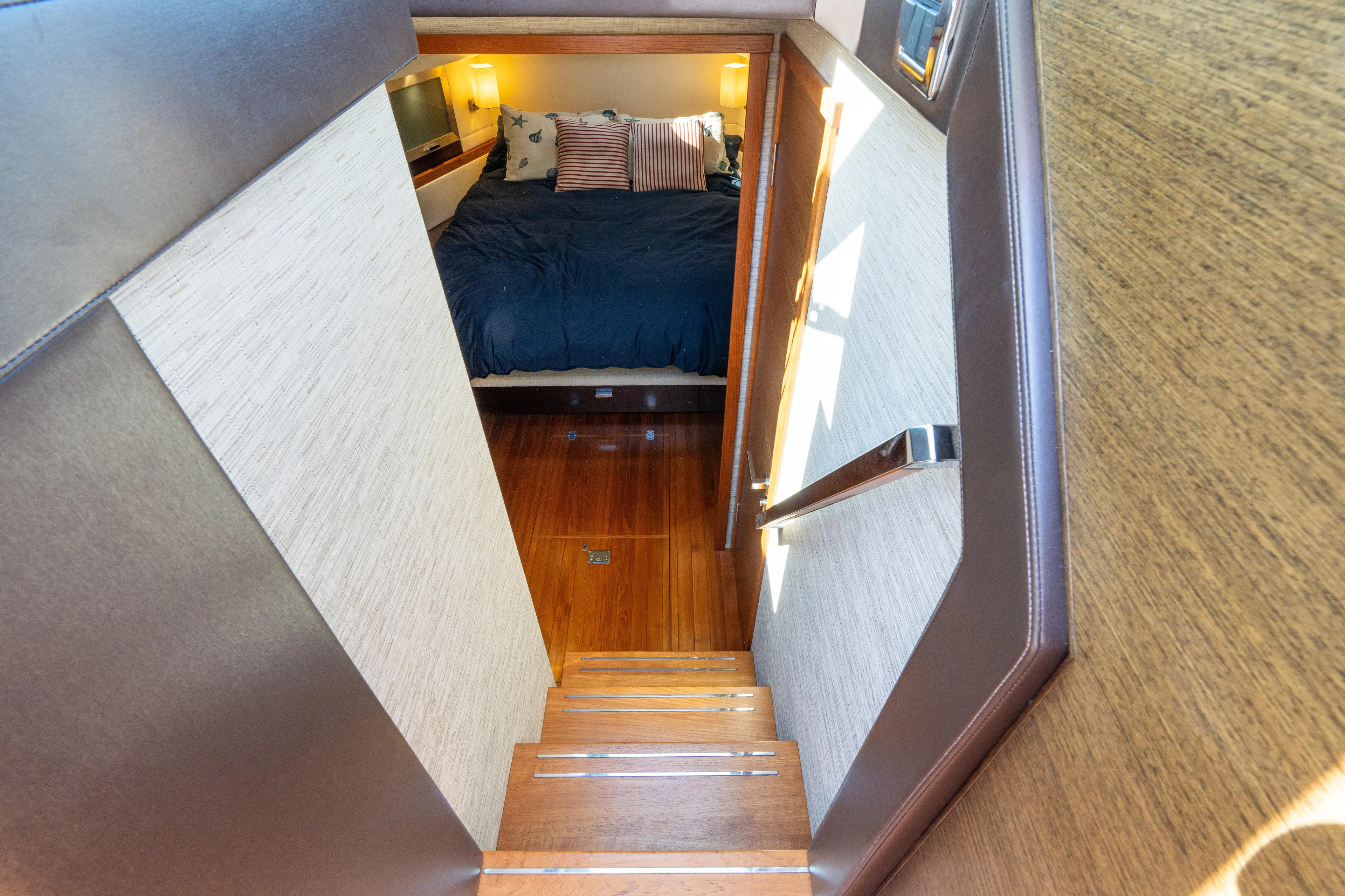 Pyrite Yacht Photos Pics Staircase leading to cozy bedroom in 2015 Tiara Yachts C44 Coupe.