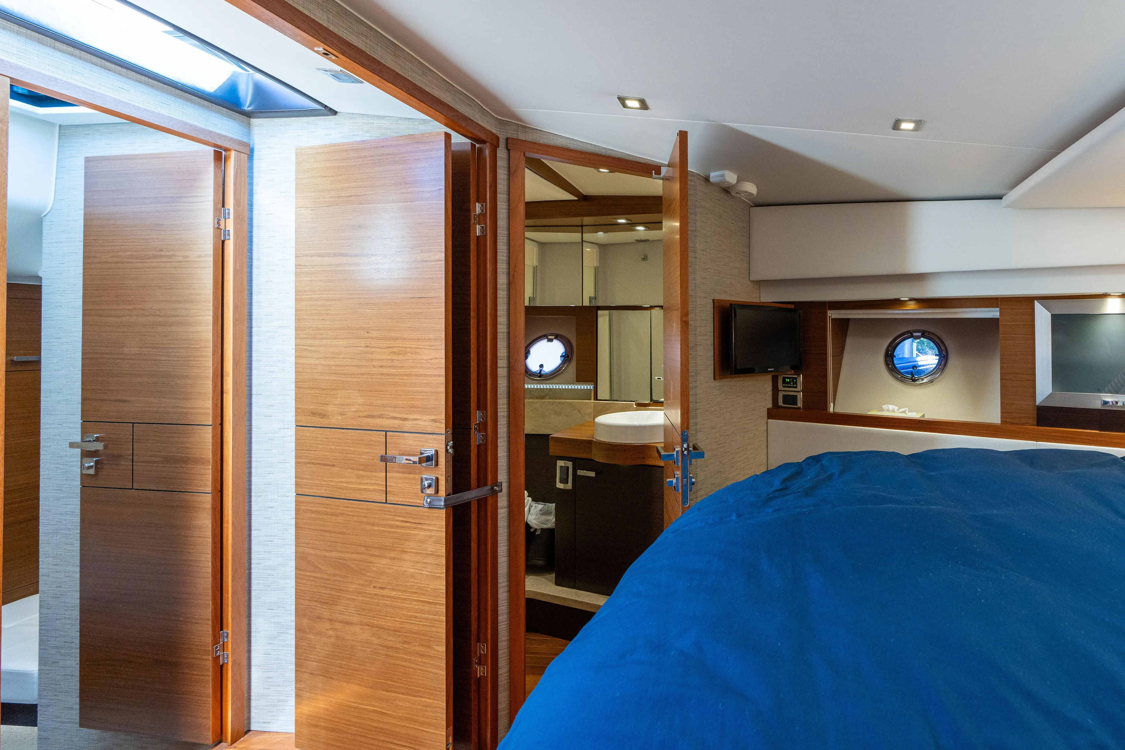 Pyrite Yacht Photos Pics Interior of 2015 Tiara Yachts C44 Coupe, featuring wood finishes and modern amenities.