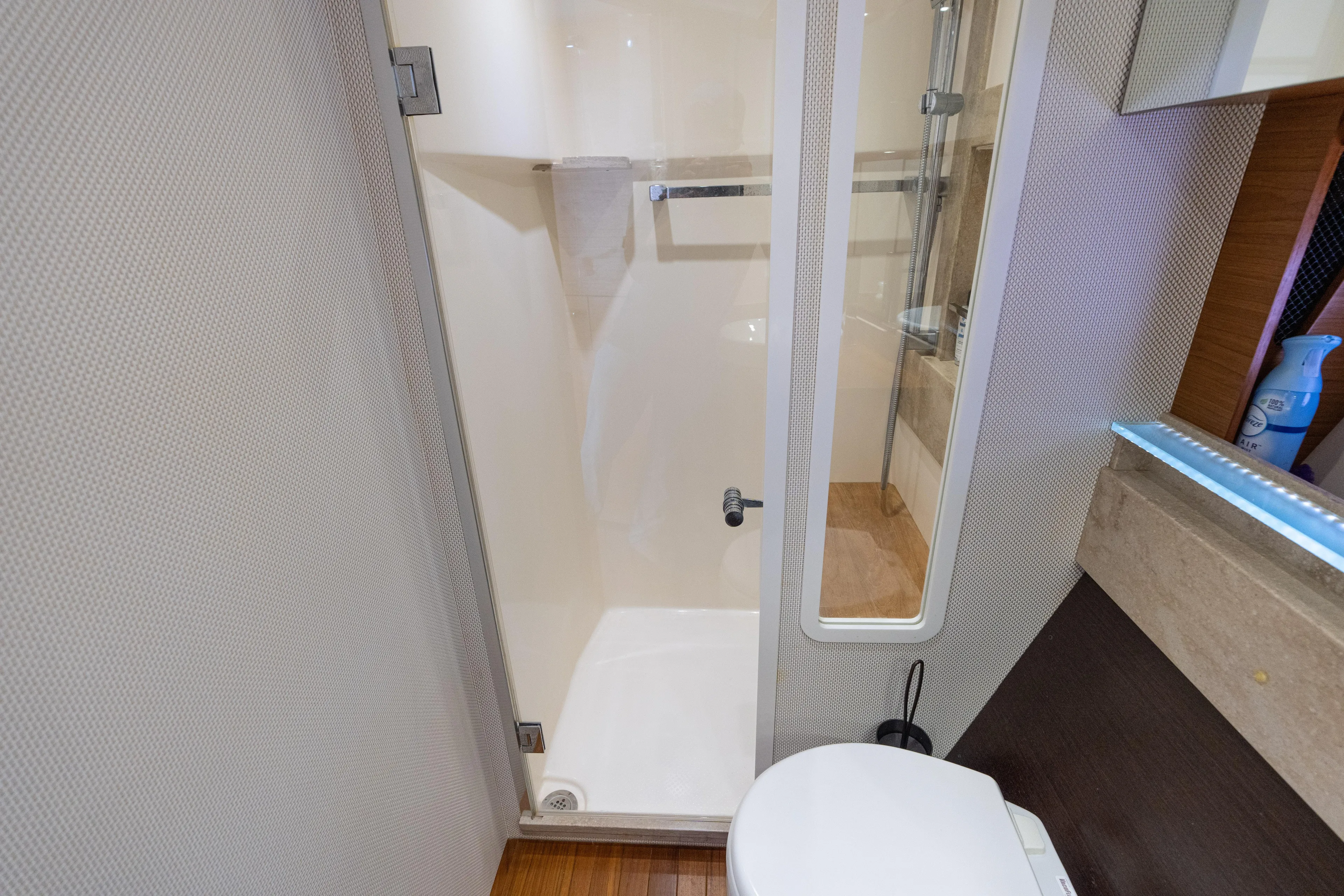 Pyrite Yacht Photos Pics Bathroom interior of 2015 Tiara Yachts C44 Coupe with shower and toilet.