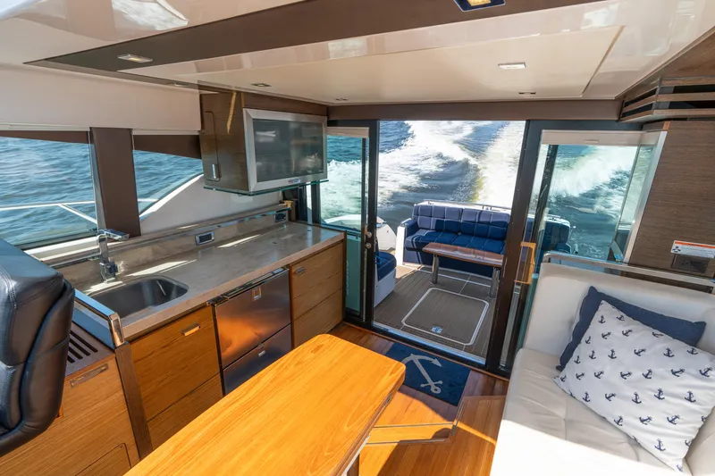 Pyrite Yacht Photos Pics Interior of 2015 Tiara Yachts C44 Coupe with modern kitchen and ocean view.