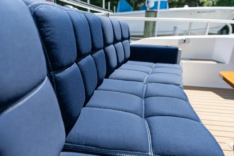 Pyrite Yacht Photos Pics Luxurious blue seating on 2015 Tiara Yachts C44 Coupe deck.