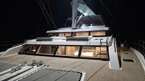 Little Giant Yacht Photos Pics Luxurious 2017 Sunreef 88 DD yacht deck illuminated at night.