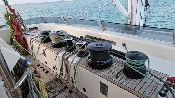 Little Giant Yacht Photos Pics Deck of 2017 Sunreef 88 DD yacht with winches and ropes, ocean in background.