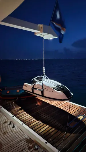 Little Giant Yacht Photos Pics Luxury yacht Sunreef 88 DD with jet ski at night, 2017 model.