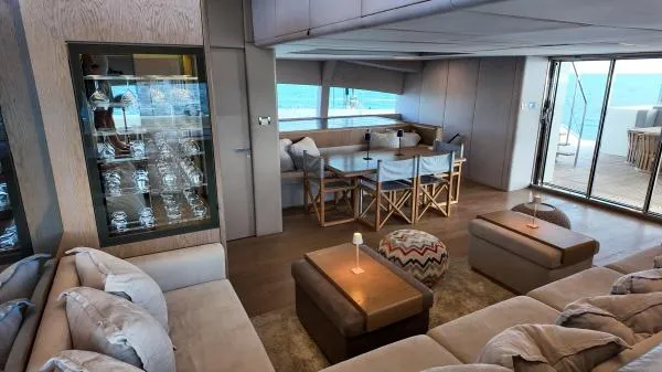 Little Giant Yacht Photos Pics Luxurious interior of 2017 Sunreef 88 DD yacht with elegant seating and ocean view.