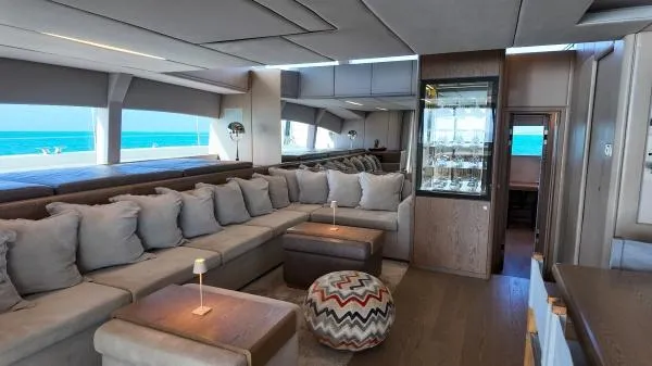 Little Giant Yacht Photos Pics Luxurious interior of 2017 Sunreef 88 DD yacht with plush seating and ocean view.