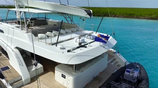 Little Giant Yacht Photos Pics Luxurious 2017 Sunreef 88 DD yacht on turquoise waters, featuring spacious deck and modern amenities.