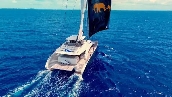 Little Giant Yacht Photos Pics Luxury Sunreef 88 DD catamaran sailing on open ocean, 2017 model.