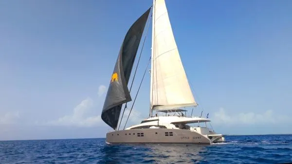 Little Giant Yacht Photos Pics Luxury Sunreef 88 DD yacht sailing on open sea, 2017 model, with dual sails.