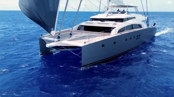 Little Giant Yacht Photos Pics Luxury Sunreef 88 DD catamaran sailing on open blue sea, 2017 model.