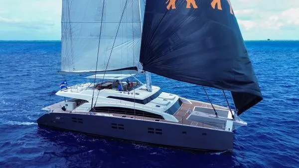 Little Giant Yacht Photos Pics Luxury Sunreef 88 DD catamaran sailing on open ocean, 2017 model.