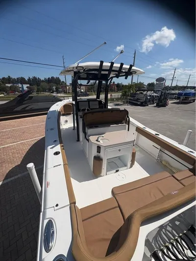  Yacht Photos Pics 2022 SeaHunter 275 ULTRA boat with sleek design and spacious deck in a sunny marina.