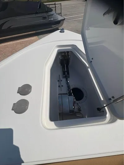  Yacht Photos Pics 2022 SeaHunter 275 ULTRA boat anchor compartment with open hatch, showcasing storage space.