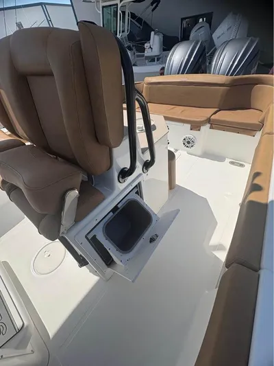  Yacht Photos Pics 2022 SeaHunter 275 ULTRA boat interior with brown seating and storage compartment.