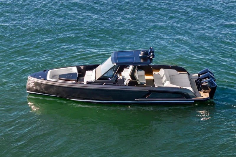  Yacht Photos Pics 2024 Vanquish Yachts 40 luxury boat cruising on open water.