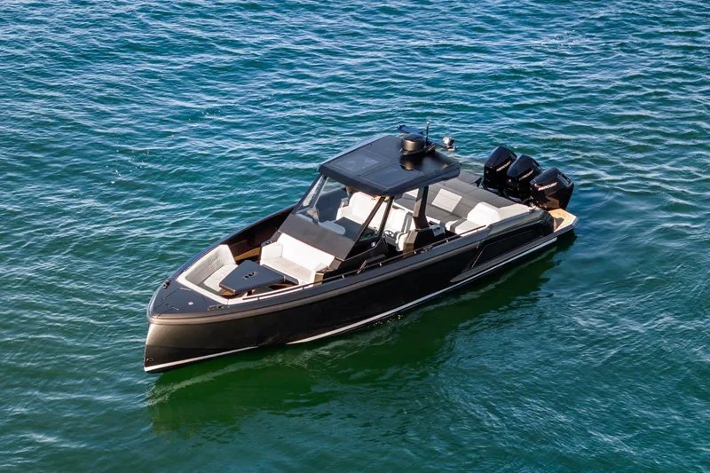  Yacht Photos Pics 2024 Vanquish Yachts 40 luxury boat on open water, sleek design, powerful engines.