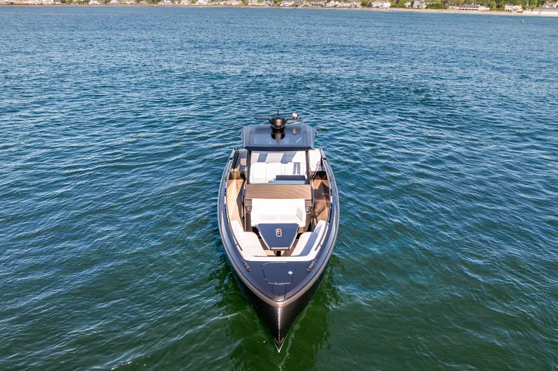  Yacht Photos Pics 2024 Vanquish Yachts 40 on open water, showcasing sleek design and luxury features.