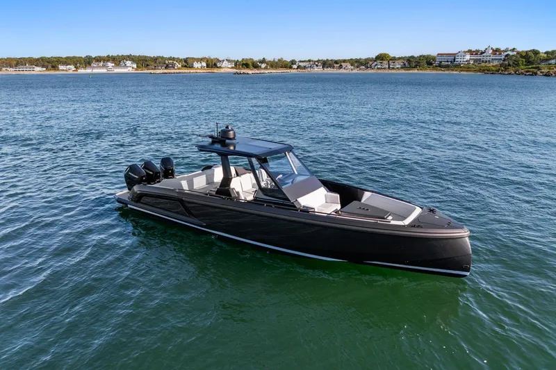  Yacht Photos Pics 2024 Vanquish Yachts 40 on serene water, showcasing sleek design and luxury features.