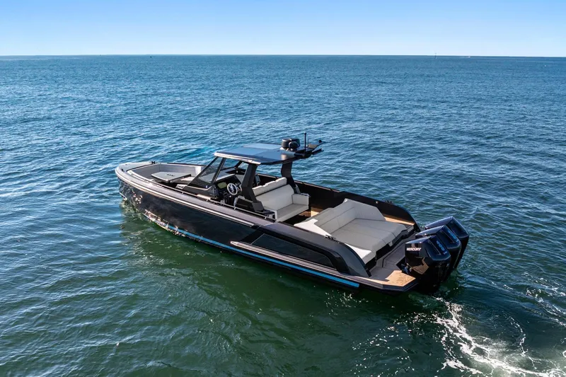  Yacht Photos Pics 2024 Vanquish Yachts 40 cruising on open water, showcasing sleek design and luxury features.