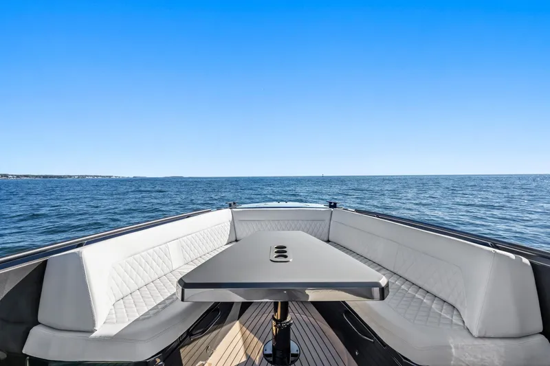  Yacht Photos Pics Luxurious 2024 Vanquish Yachts 40 with elegant seating and ocean view.