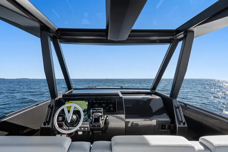  Yacht Photos Pics Interior view of 2024 Vanquish Yachts 40, showcasing modern helm and ocean horizon.