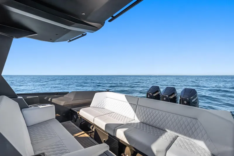  Yacht Photos Pics Luxurious 2024 Vanquish Yachts 40 with elegant seating, ocean view, and powerful engines.