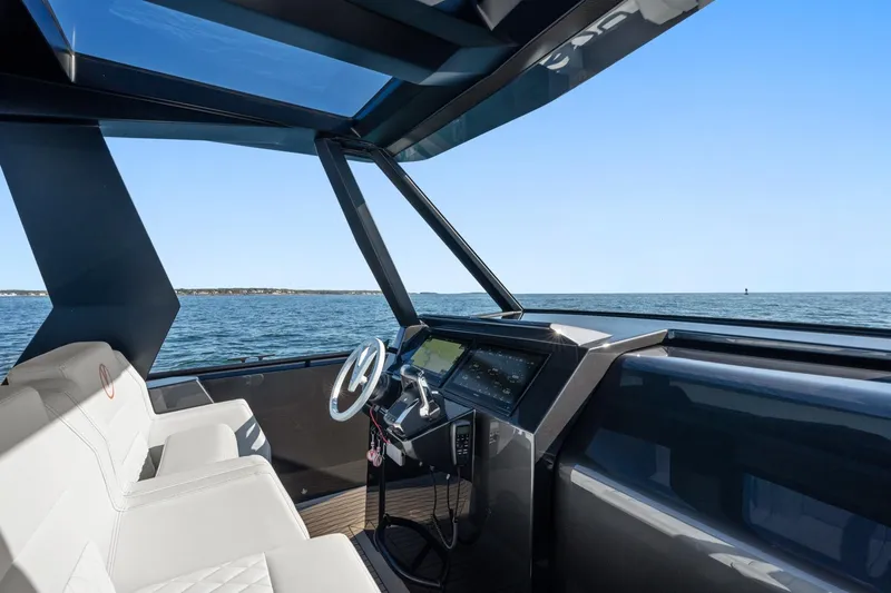  Yacht Photos Pics Interior view of 2024 Vanquish Yachts 40, featuring sleek design and ocean backdrop.