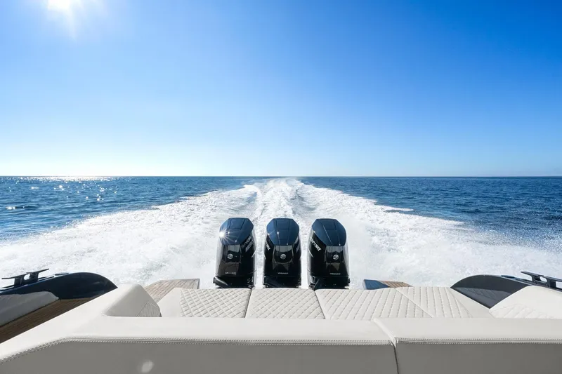  Yacht Photos Pics 2024 Vanquish Yachts 40 cruising on open sea with powerful triple engines.