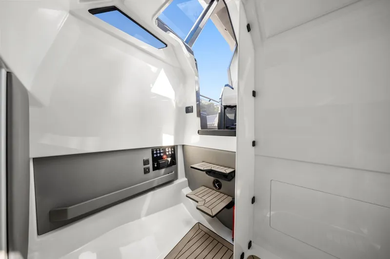  Yacht Photos Pics 2024 Vanquish Yachts 40 interior cabin with modern design and wooden steps.