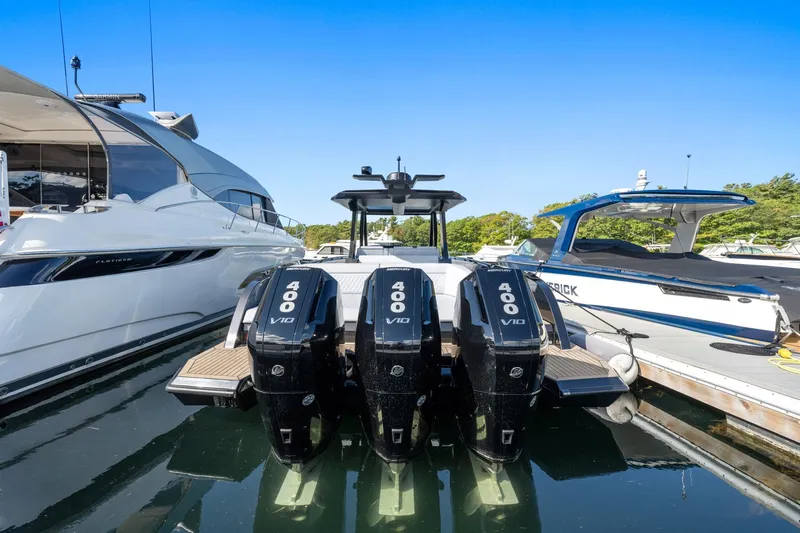  Yacht Photos Pics 2024 Vanquish Yachts 40 with triple 400 V10 engines docked at marina.