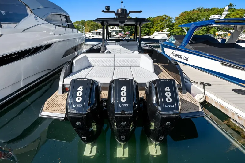 Yacht Photos Pics 2024 Vanquish Yachts 40 with triple Mercury 400 V10 engines docked at marina.
