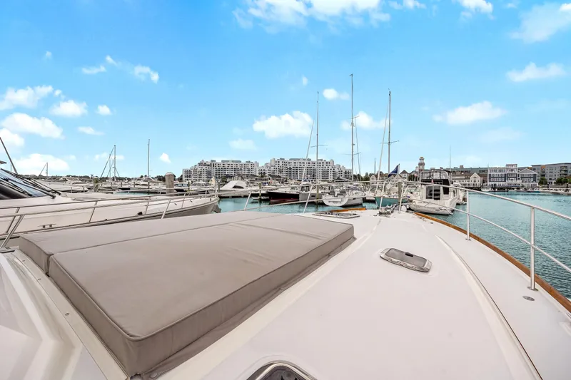 Second Rodeo Yacht Photos Pics 2018 Sabre 48 Salon Express yacht docked in a marina with clear blue skies.