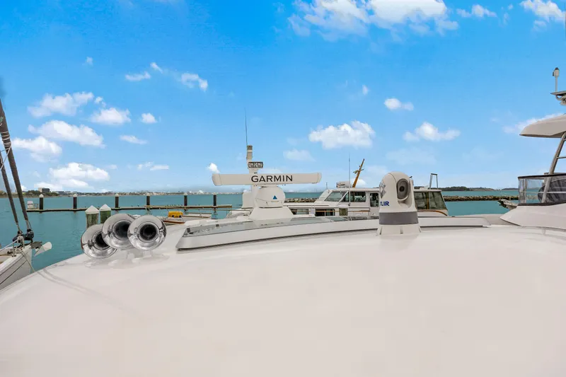 Second Rodeo Yacht Photos Pics 2018 Sabre 48 Salon Express yacht with Garmin equipment, docked under a clear blue sky.