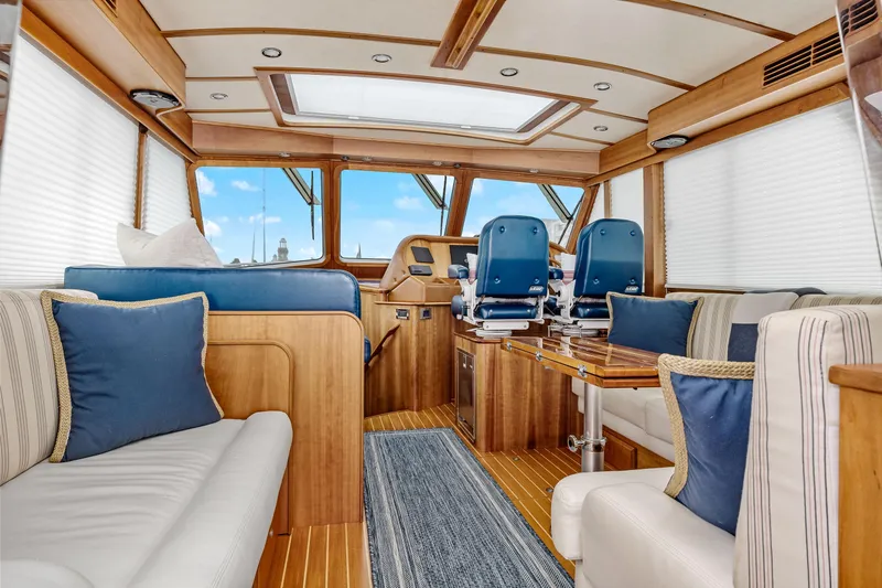 Second Rodeo Yacht Photos Pics Luxurious interior of 2018 Sabre 48 Salon Express yacht with elegant wood finishes and plush seating.