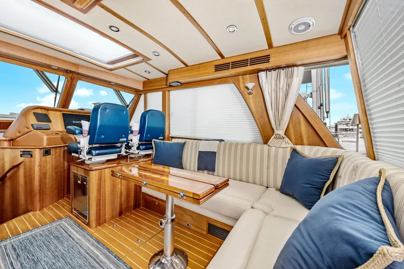 Second Rodeo Yacht Photos Pics Luxurious interior of 2018 Sabre 48 Salon Express yacht with plush seating and elegant wood finishes.