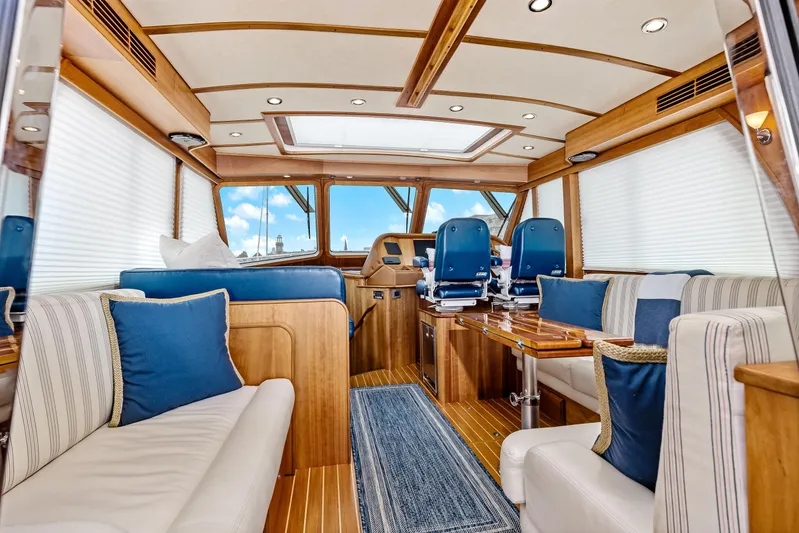 Second Rodeo Yacht Photos Pics Interior of 2018 Sabre 48 Salon Express yacht with luxurious seating and helm.