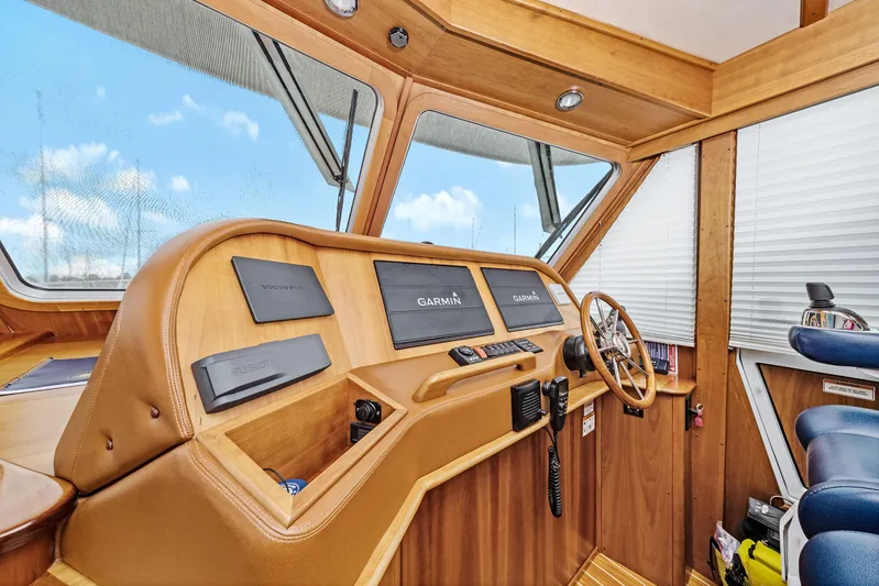 Second Rodeo Yacht Photos Pics 2018 Sabre 48 Salon Express helm with Garmin navigation and wooden interior.