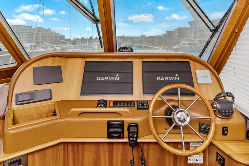Second Rodeo Yacht Photos Pics 2018 Sabre 48 Salon Express helm with Garmin navigation and wooden steering wheel.
