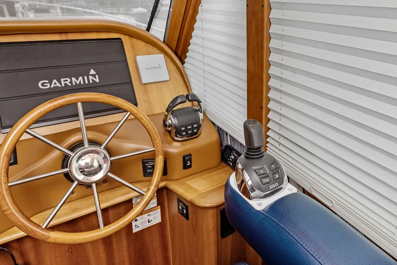 Second Rodeo Yacht Photos Pics Steering wheel and controls of 2018 Sabre 48 Salon Express yacht with Garmin system.